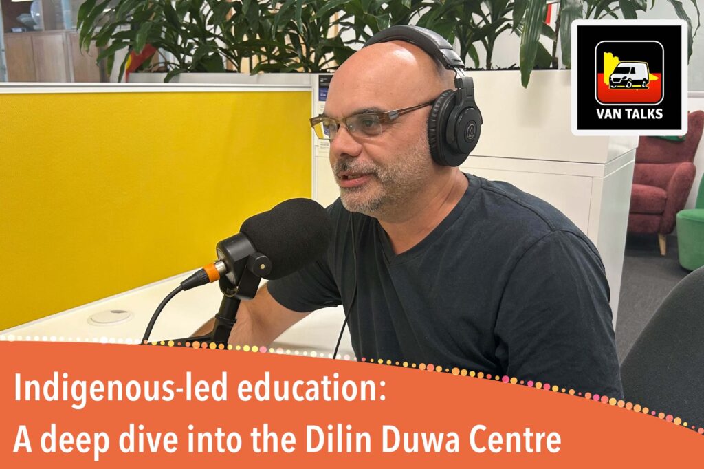 Paul Paton A man with glasses and headphones speaks into a professional microphone during a podcast recording. A logo for "Van Talks" is in the corner, and an orange banner at the bottom reads: "Indigenous-led education: A deep dive into the Dilin Duwa Centre."